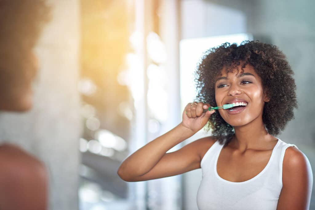 Woman brushing her teeth